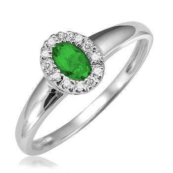 Elegant emerald engagement ring featuring a dazzling green emerald centerpiece, surrounded by sparkling diamonds set in a sleek white gold band, perfect for timeless sophistication