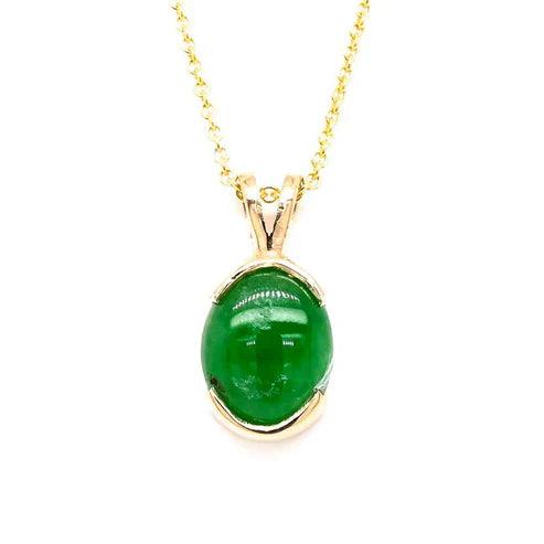 Elegant jade pendant featuring a smooth, polished finish, symbolizing purity and serenity. This exquisite piece is perfect for both casual and formal occasions