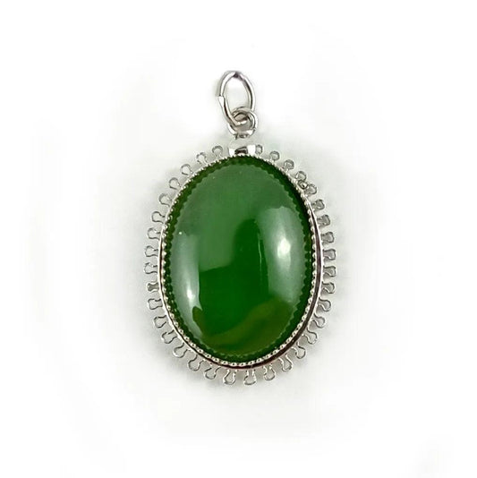 Beautiful jade pendant showcasing intricate design, perfect for enhancing your jewelry collection. Available at Bellemare Dugas Jewelry Store