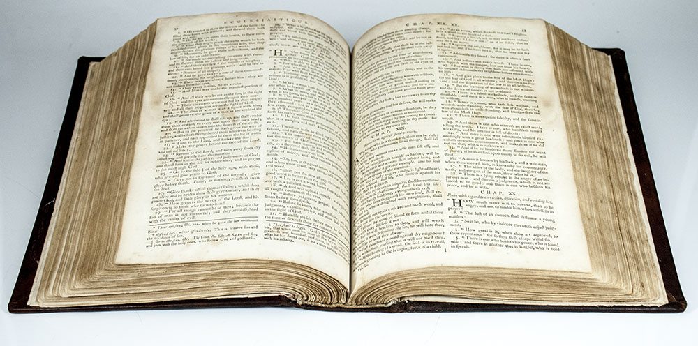 Open Holy Bible showcasing sacred scripture pages