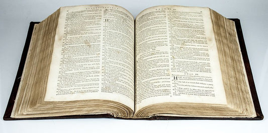 Open Holy Bible showcasing sacred scripture pages